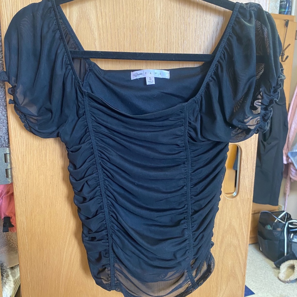 Black going out top